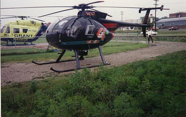 The old WCMH TV "Chopper 4" landed at Wellston Heliport Base while covering a breaking news story, as Grant Lifeflight II's BK 117 N4493X sits nearby