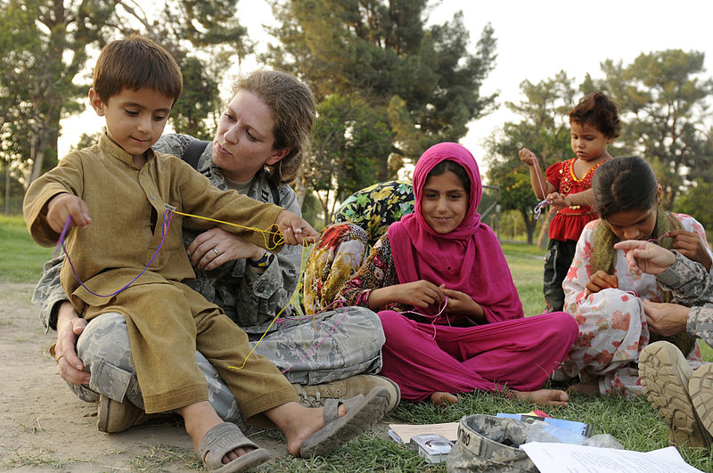 File:Defense.gov News Photo 100821-F-5281B-142 - U.S. Air Force Capt. Mary Danner-Jones a public affairs officer with the Nangarhar Provincial Reconstruction Team teaches an Afghan boy and his.jpg