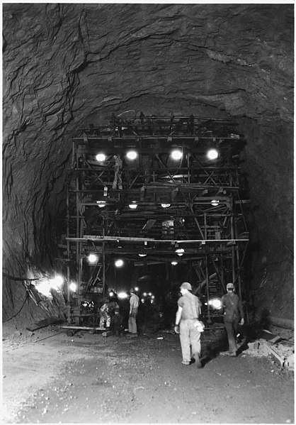 File:Drilling jumbo used in upper 36 feet of 41-foot diameter upper penstock header. This view shows the drilling face. - NARA - 293854.jpg