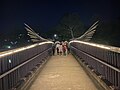 The majestic "wings" of oars along Elizabeth Park bridge in Parramatta, combined with the lighting and camera framing of a group of young people far ahead on the bridge really captures the whimsical mood of this photo.