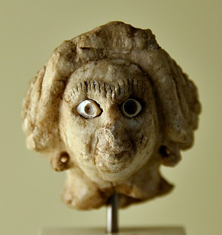 Head of a female figure, dating to the Akkadian period (c. 2334–2154 BC), found at Assur, on display at the Pergamon Museum in Berlin.