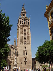 La Giralda, originally built by the Almohads as a minaret to the Great Mosque of Seville, is now the bell tower of the cathedral. Giralda de Sevilla 5.jpg