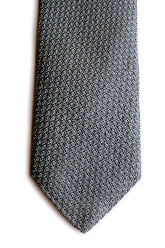 Tie made with silver color silk in grenadine weave Grenadine silk tie color silver.jpg