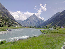 Kishanganga river flowing through the Gurez valley, with the pyramid-shaped Habba Khatoon mountain in the background