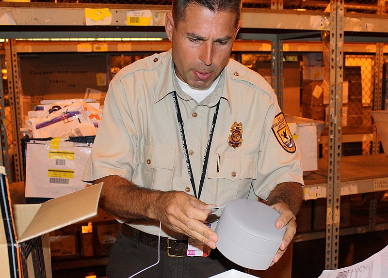 File:Inspector examines shipment at Newark International Airport (6103515769).jpg