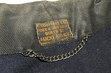 Chain coat-hanger detail. Jacket (military), wool, dated 1900. Auckland War Memorial Museum Tamaki Paenga Hira: 739982 (object number). Jacket, military (AM 739982-7).jpg