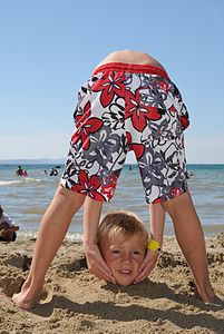 178 votes; Statistics (R1) Two boys at the beach. One is buried in the sand and the other is bending forward while holding the other's head. (Not a photo montage) (POTD) Böhringer Friedrich (Böhringer)