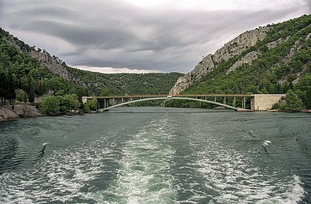 The Krka river and a bridge at the park's border