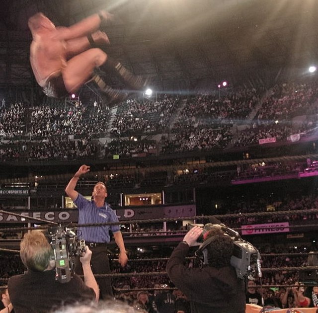 Brock Lesnar performing a highspot; a shooting star press at WrestleMania XIX