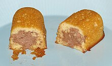 A cross-section of "Limited Edition" Chocolate Creme Twinkies from 2011 Limited Edition Hostess Chocolate Creme Twinkies Innards (5554819469).jpg