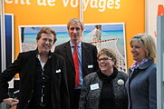 Lëtzebuergesch: D'Ministesch fir Tourismus Françoise Hetto mat Responsabele vu Lëtzebuerger Reesbüroen op der Foire Vakanz 2013.