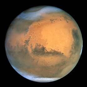 Mars in natürlichen Farben, aufgenommen mit dem Hubble-Weltraumteleskop.