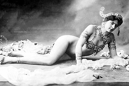 Mata Hari. The most celebrated segment of her stage act was the progressive shedding of her clothing until she wore just a jeweled bra and some ornaments over her arms and head