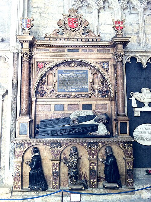 Monument with semi-recumbent effigy of Archbishop Matthew Hutton in the south choir aisle of York Minster, showing his arms as Archbishop of York and 