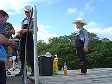 Mennonite children selling peanuts to tourists near Lamanai, Belize Menonite Children.JPG