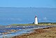 Faro de la isla Miscou en la distancia