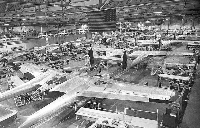 The assembly line for Northrop P-61 Black Widows at the Northrop plant in Hawthorne, California in World War II. Center wings and fuselages take shape