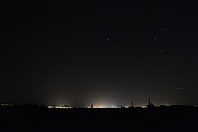 The city of Phoenix, seen from 55 miles (89 km) away in Surprise, Arizona Phoenix Lights from afar.jpg