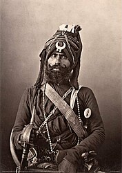 Photograph of a Nihang bodyguard serving in the Nizam of Hyderabad's irregular Sikh army, ca.1865.jpg