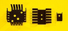 Power transistor heat sinks. Left for TO-3 package, right for TO-220 package, middle for two TO-220. Power Transistor Heat Sinks.jpg