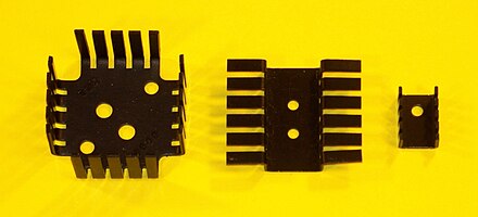 Power transistor heat sinks. Left for TO-3 package, right for TO-220 package, middle for two TO-220.
