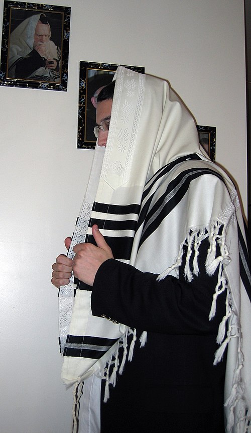 A tallit with black stripes according to the Orthodox Ashkenazic tradition