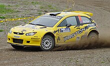 Alister McRae in his Proton Satria Neo S2000 at Rally Hokkaido during the 2010 APRC season.