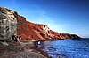 A red pebble beach in the south of Thira.