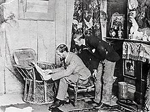 Unknown photographer (c.1890) Tom Roberts (seated) in his studio at Grosvenor Chambers with Arthur Streeton Roberts Streeton.jpg