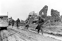 Soldiers from the 121st Infantry Regiment in Hurtgen, Germany during December 1944 Ruins of Hurtgen (23002508894).jpg