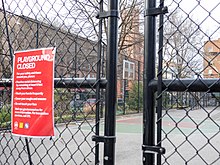 In many New York City parks, hoops were removed from basketball courts to discourage people being in groups. Signs during pandemic in Brooklyn (20555).jpg