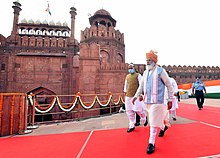 Prime Minister Narendra Modi walking towards the dais to address the Nation at Red Fort, on the occasion of 75th Independence Day, in Delhi on 15 August 2021. The Prime Minister, Shri Narendra Modi walking towards the dais to address the Nation at Red Fort, on the occasion of 75th Independence Day, in Delhi on August 15, 2021 (2).jpg
