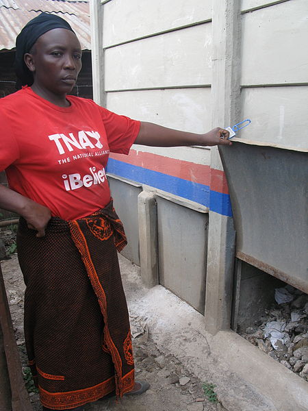 File:The landlady opens the vault door of a urine-diverting dry toilet (UDDT) in low-income area Bulbul near Nairobi, Kenya (10543236395).jpg