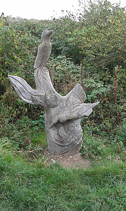 Tree stump sculpture at Port Sunlight River Park (30099888911).jpg