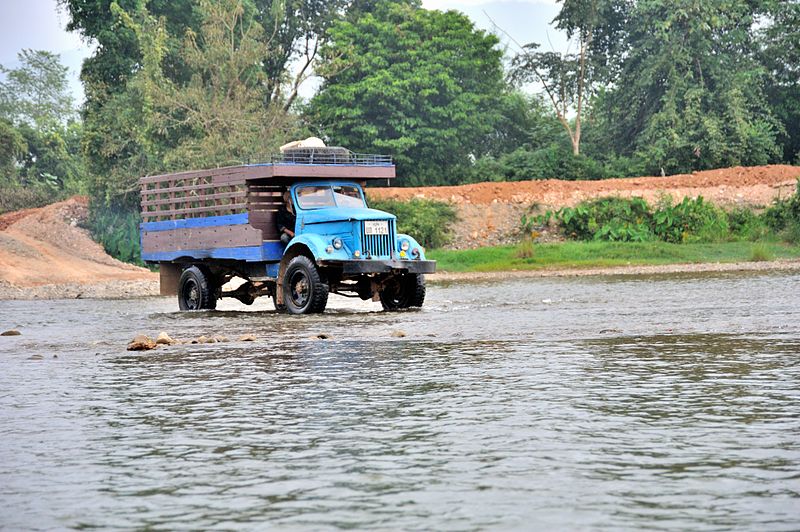 File:Truck in Laos in the river.jpg