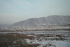 The Tumen River, at the border between North Korea and China. Picture taken from the Chinese side of the Tumen River at Tumen City; the city of Namyang, North Korea is on the other side of the river