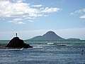 Statue of Wairaka (left), with Moutohorā Island