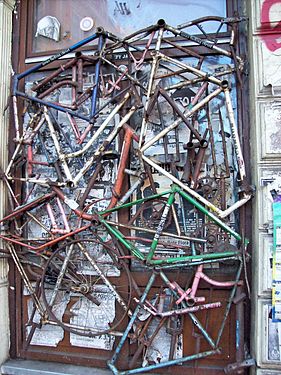 Window in Hamburg-Altona, Germany. Full with old bicycle fragments on the outside