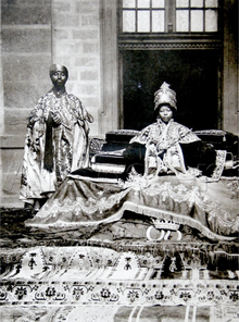 Empress Zewditu I accompanied by a priest Zewditu and favored priest.png