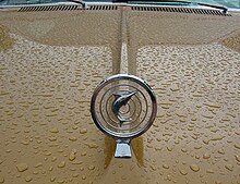 1967_AMC_Marlin_two-door_fastback_sungold_and_white-wet_hood_ornament.jpg
