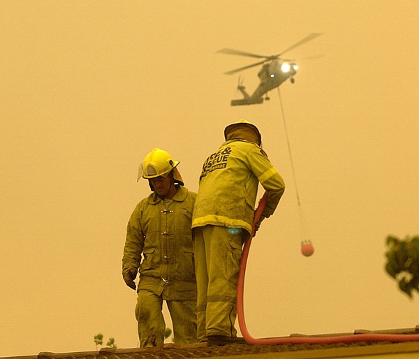 ACTFB firefighters hosing down the roof of the Emergency Services Bureau.