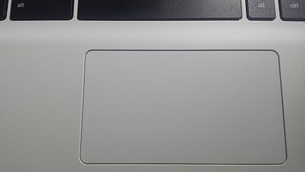Closeup of a touchpad on an Acer laptop, where buttons and the touch-sensitive surface are shared