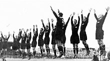 The All Blacks at the climax of their haka before a 1932 test against Australia Allblacks haka 1932.jpg