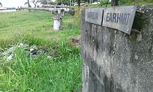 Amelia Earhart monument situated near old airfield. Note the Japanese anti-aircraft gun. Bronze plaque since stolen. Photo taken 7 January 2014 Amelia Earhart monument.jpg