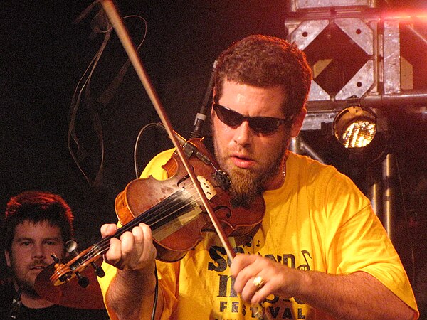 MacIsaac performing at the Burlington Sound of Music festival in 2010. Neil MacIntosh also pictured on drums.