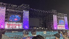 The stage for the BanG Dream! 9th Live's first concert, The Beginning by Poppin'Party and Roselia, at Fuji-Q Highland Conifer Forest on August 22, 2021 BanG Dream! 9thLIVE The Beginning.jpg