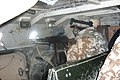 A Romanian soldier aiming his "Mitraliera md. 1966" (licensed built PK machine gun) from the interior of a TABC-79 armored vehicle while on mission in Afghanistan.