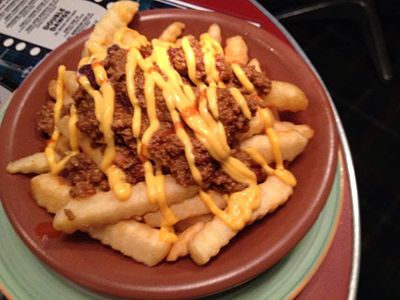 French fries topped with chili con carne and cheese sauce