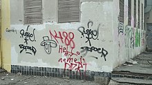 Graffiti with 1488 and an obscure message on a wall in Volzhsky, Volgograd Oblast, Russia Cursed graffiti in Volzhsky.jpg