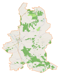 Mapa konturowa gminy Dąbrowa Tarnowska, blisko centrum na lewo znajduje się punkt z opisem „Dąbrowa Tarnowska”